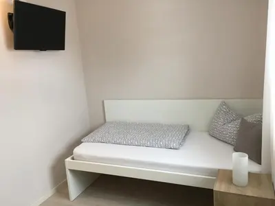 Ein Bett oder Betten in einem Zimmer der Unterkunft Pension M