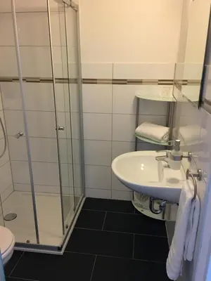 Ein Badezimmer in der Unterkunft Pension M