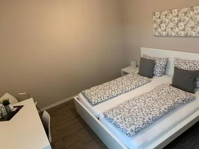 Ein Bett oder Betten in einem Zimmer der Unterkunft Pension M