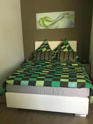 Ein Bett oder Betten in einem Zimmer der Unterkunft Bürgemeister Apartment
