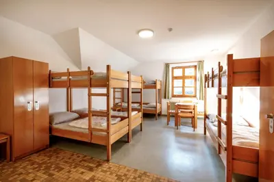 Ein Bett oder Betten in einem Zimmer der Unterkunft Jugendherberge Schliersee
