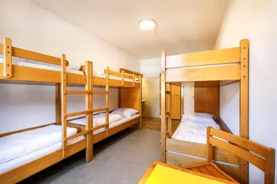 Ein Bett oder Betten in einem Zimmer der Unterkunft Jugendherberge Schliersee