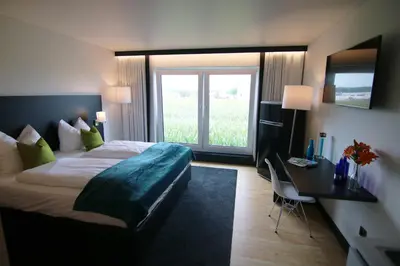 Ein Bett oder Betten in einem Zimmer der Unterkunft MN Hotel by WMM Hotels