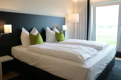 Ein Bett oder Betten in einem Zimmer der Unterkunft MN Hotel by WMM Hotels