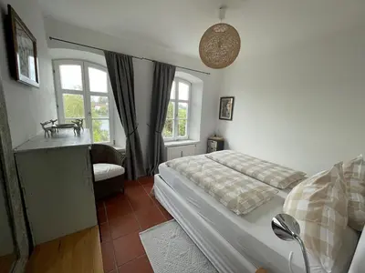 Ein Bett oder Betten in einem Zimmer der Unterkunft Chiemgau, Seeblick, Haus am Weinberg, 83370 Seeon Oberbayern