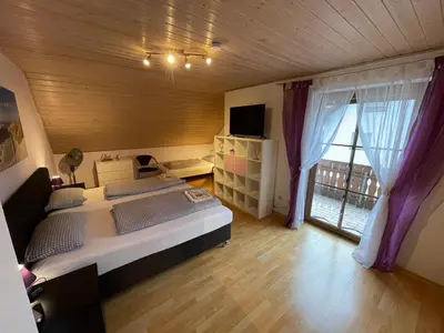 Ein Bett oder Betten in einem Zimmer der Unterkunft Ferienhaus Ferienwohnung Aretsried