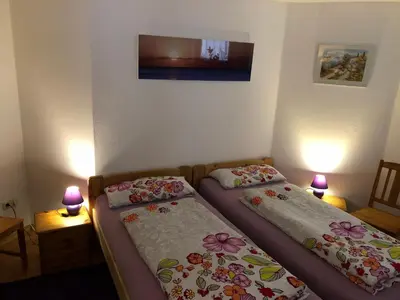 Ein Bett oder Betten in einem Zimmer der Unterkunft Ferienhaus Ferienwohnung Aretsried