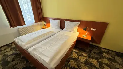 Ein Bett oder Betten in einem Zimmer der Unterkunft Hotel Der Tannenbaum