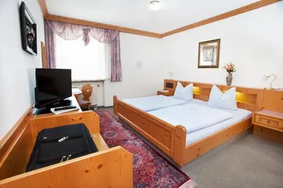 Ein Bett oder Betten in einem Zimmer der Unterkunft Hotel Hubertus