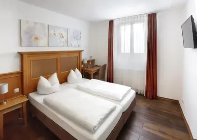 Ein Bett oder Betten in einem Zimmer der Unterkunft Restaurant-Café-Pension Himmel