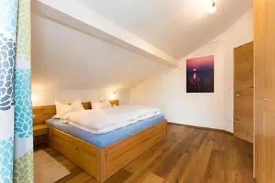 Ein Bett oder Betten in einem Zimmer der Unterkunft Zaißlhäusl Hof Ferienwohnungen