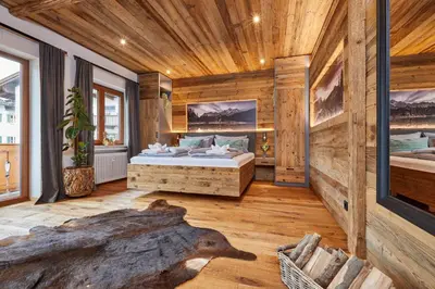 Ein Bett oder Betten in einem Zimmer der Unterkunft Alpis Ferienwohnung