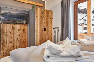 Ein Bett oder Betten in einem Zimmer der Unterkunft Alpis Ferienwohnung