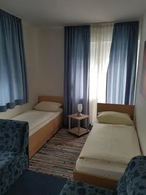 Ein Bett oder Betten in einem Zimmer der Unterkunft Hotel Giesing