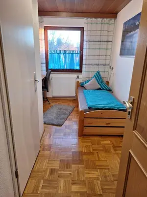 Ein Bett oder Betten in einem Zimmer der Unterkunft Ferienwohnung Sirch