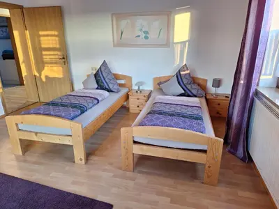 Ein Bett oder Betten in einem Zimmer der Unterkunft Ferienwohnung Sirch