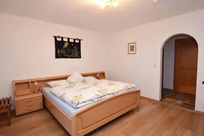 Ein Bett oder Betten in einem Zimmer der Unterkunft Ferienwohnung Panorama im Gästehaus Bergfrieden