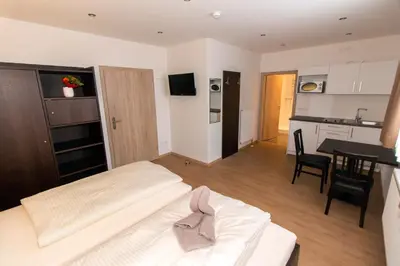 Ein Bett oder Betten in einem Zimmer der Unterkunft Gästehaus am Lindenhain