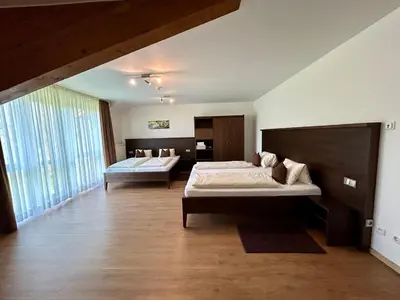 Ein Bett oder Betten in einem Zimmer der Unterkunft Gästehaus am Lindenhain