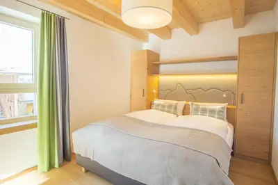 Ein Bett oder Betten in einem Zimmer der Unterkunft Ferienwohnung In den Bergen