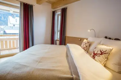 Ein Bett oder Betten in einem Zimmer der Unterkunft Ferienwohnung In den Bergen