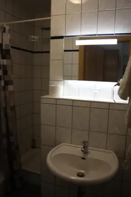 Ein Badezimmer in der Unterkunft Pension Kirchenwirt