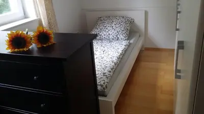 Ein Bett oder Betten in einem Zimmer der Unterkunft Wiflinger Graben Einfamilienhaus