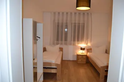 Ein Bett oder Betten in einem Zimmer der Unterkunft Aparthotel Sebastian