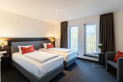 Ein Bett oder Betten in einem Zimmer der Unterkunft Hotel Duda Langenbruck an der A9 zwischen Ingolstadt und München, ideal für Stopover, Geschäftsreisen und Monteure