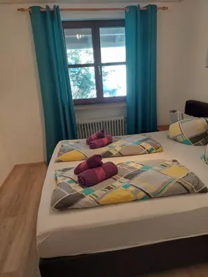 Ein Bett oder Betten in einem Zimmer der Unterkunft Ferienwohnung am Walchensee