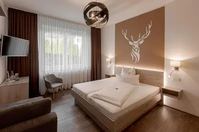 Ein Bett oder Betten in einem Zimmer der Unterkunft Hotel Kitz ehemals Schlemmerhütte