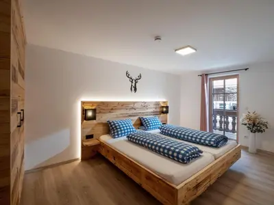 Ein Bett oder Betten in einem Zimmer der Unterkunft Berggasthof Bichlersee