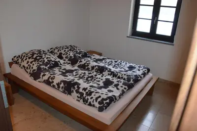 Ein Bett oder Betten in einem Zimmer der Unterkunft Ferienwohnung Emmert Landshut