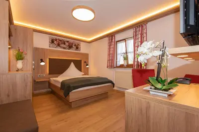 Ein Bett oder Betten in einem Zimmer der Unterkunft Pension Ludwig Thoma