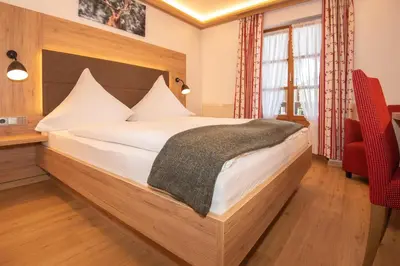 Ein Bett oder Betten in einem Zimmer der Unterkunft Pension Ludwig Thoma