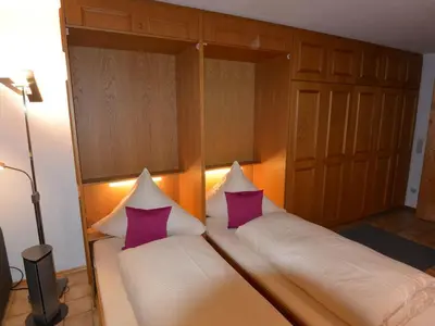 Ein Bett oder Betten in einem Zimmer der Unterkunft Ferienwohnungen Romeo-Julio-Mittenwald