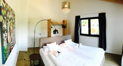 Ein Bett oder Betten in einem Zimmer der Unterkunft Ferienhaus Achmühle