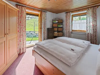 Ein Bett oder Betten in einem Zimmer der Unterkunft Alpenapartment mit Garten