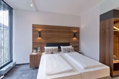 Ein Bett oder Betten in einem Zimmer der Unterkunft elaya hotel munich city, Trademark Collection by Wyndham