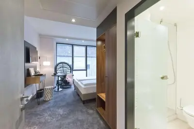 Ein Bett oder Betten in einem Zimmer der Unterkunft elaya hotel munich city, Trademark Collection by Wyndham