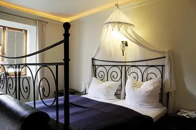 Ein Bett oder Betten in einem Zimmer der Unterkunft Schlosshof anno 1743