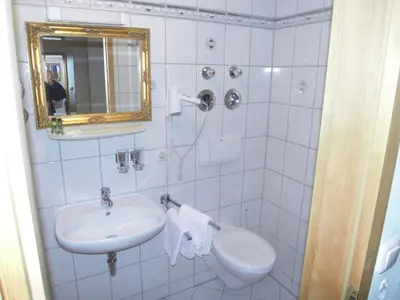 Ein Badezimmer in der Unterkunft Posthotel Sachrang