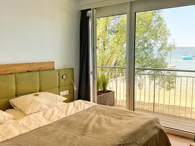 Ein Bett oder Betten in einem Zimmer der Unterkunft Seespitz Gästehaus