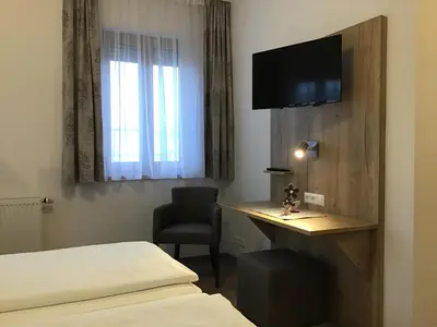 Ein Bett oder Betten in einem Zimmer der Unterkunft Gasthof Hotel Esterer