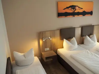 Ein Bett oder Betten in einem Zimmer der Unterkunft Gasthof Hotel Esterer