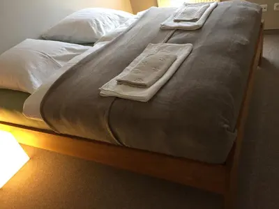 Ein Bett oder Betten in einem Zimmer der Unterkunft Spacious Starnberg Condo next to Munich