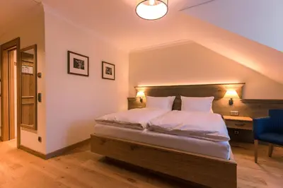 Ein Bett oder Betten in einem Zimmer der Unterkunft Hotel & Gaststätte zum Erdinger Weißbräu