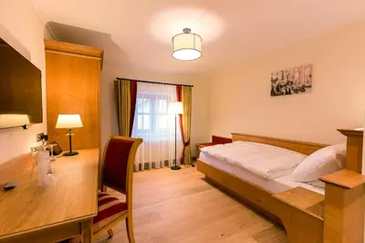 Ein Bett oder Betten in einem Zimmer der Unterkunft Hotel & Gaststätte zum Erdinger Weißbräu