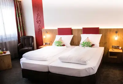 Ein Bett oder Betten in einem Zimmer der Unterkunft ROOM'Z zimmeraufzeit
