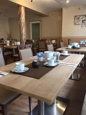 Ein Restaurant oder anderes Speiselokal in der Unterkunft Pension Wagner